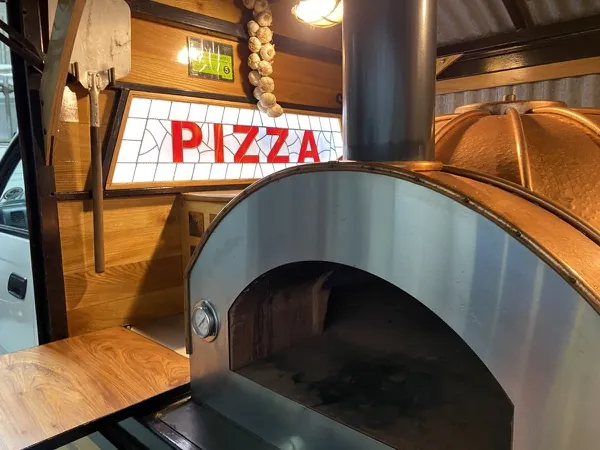 Fresh pizza straight from the wood-fired oven