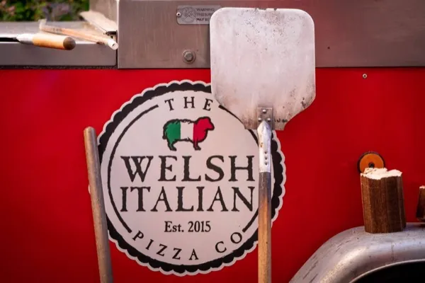 Welsh Italian Pizza Co. serving freshly sliced pizza